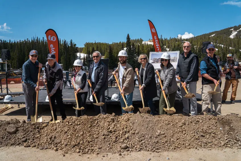people hold shovels
