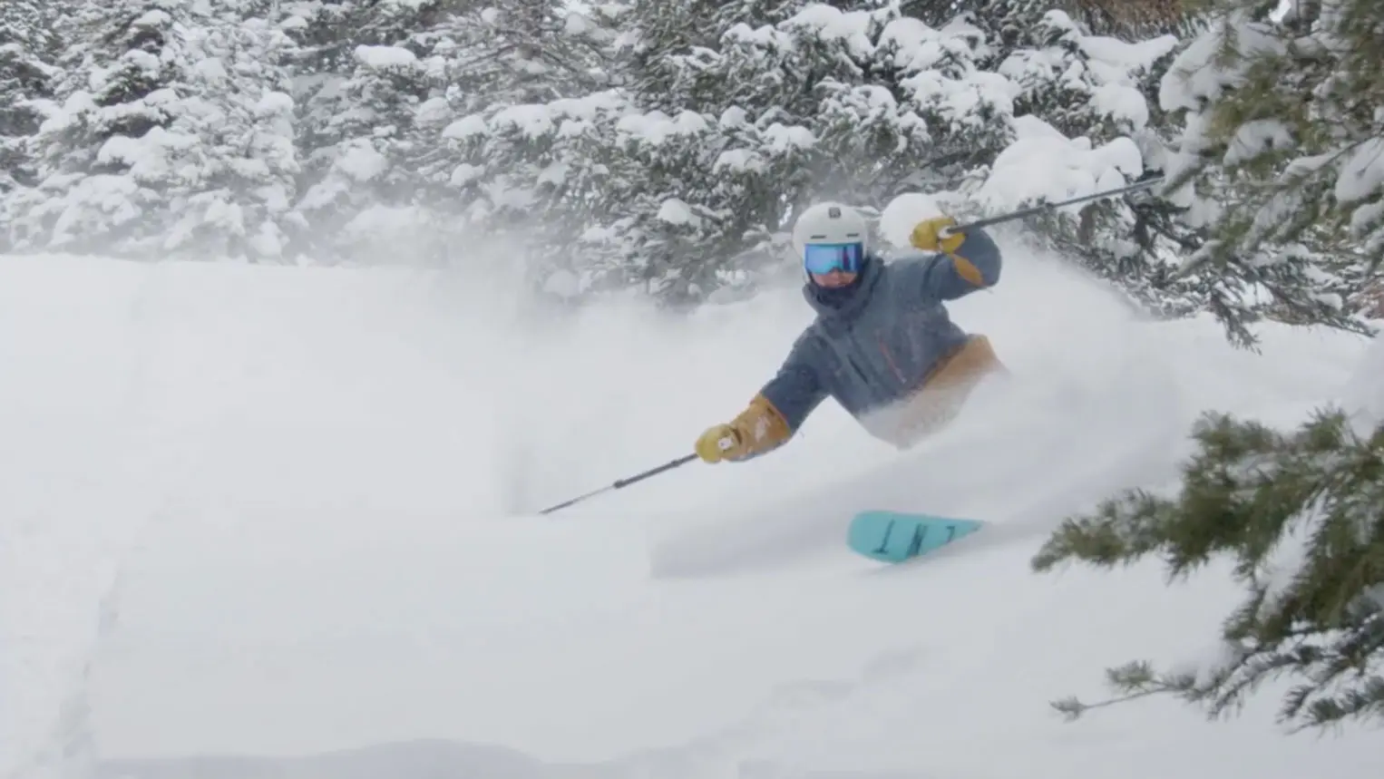 man skis through powder