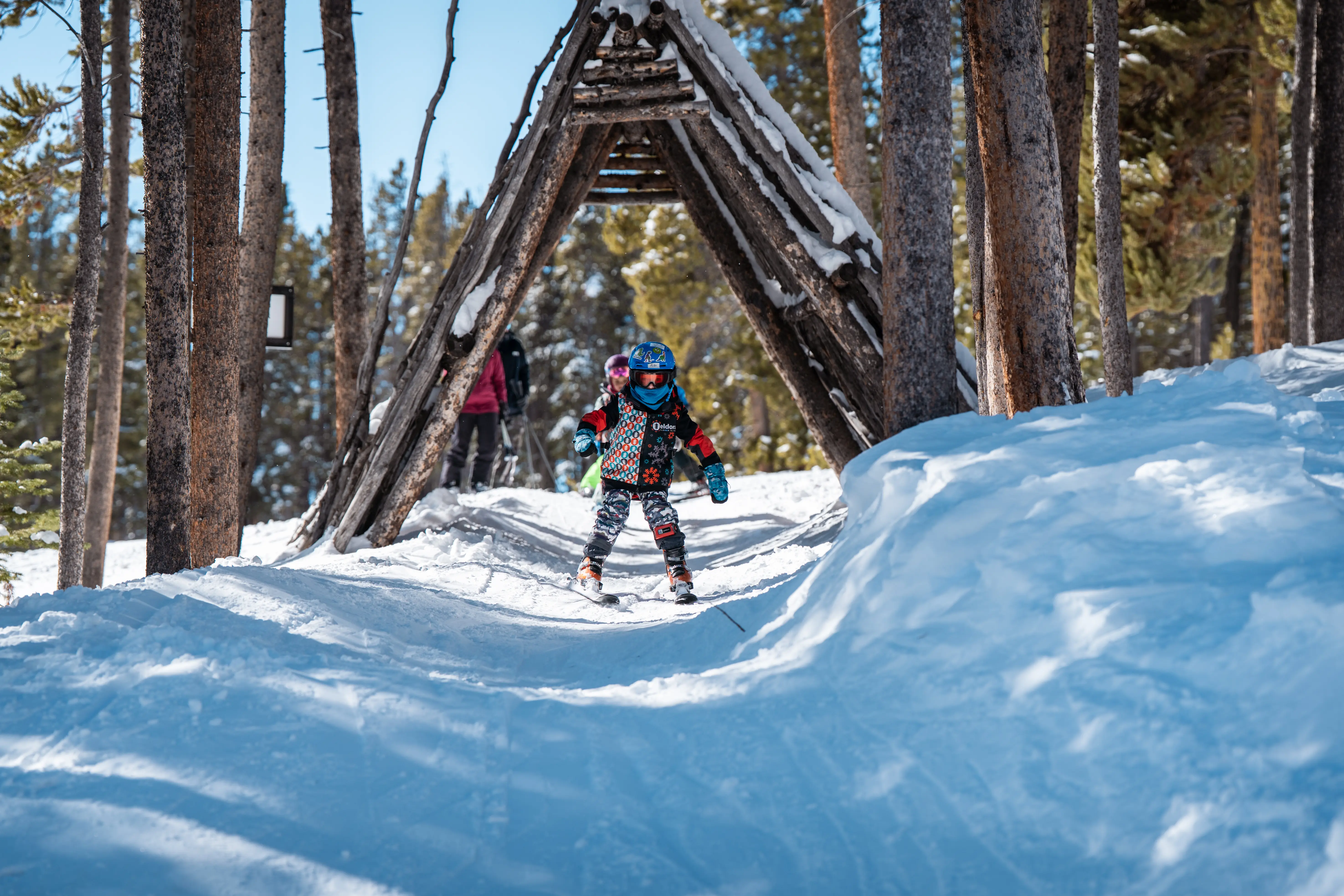 kid skis through tunnel
